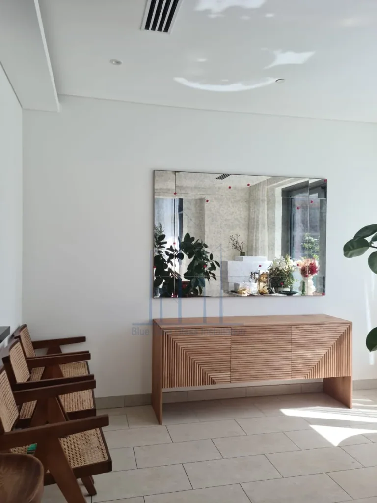 Large wall-to-wall custom mirror