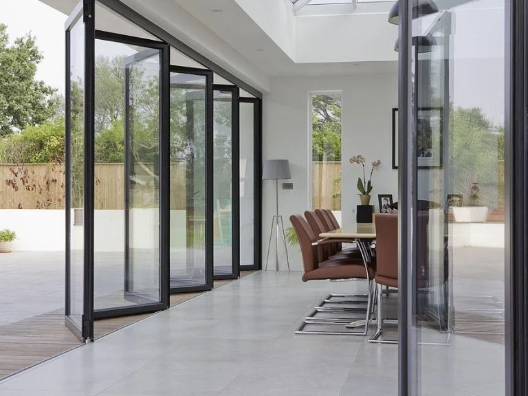 Multi-panel folding glass door