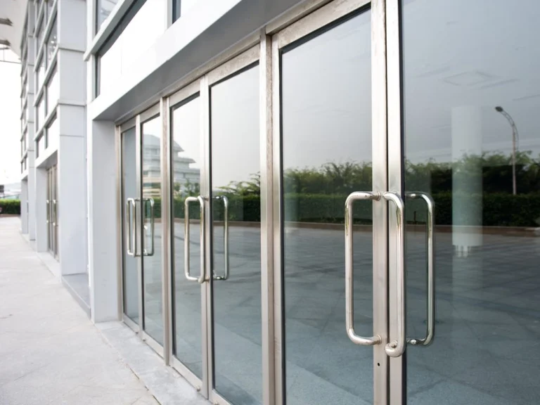 Clear hinged glass door with metal hardware
