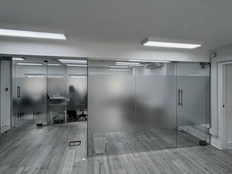 Glass partition for an interior space