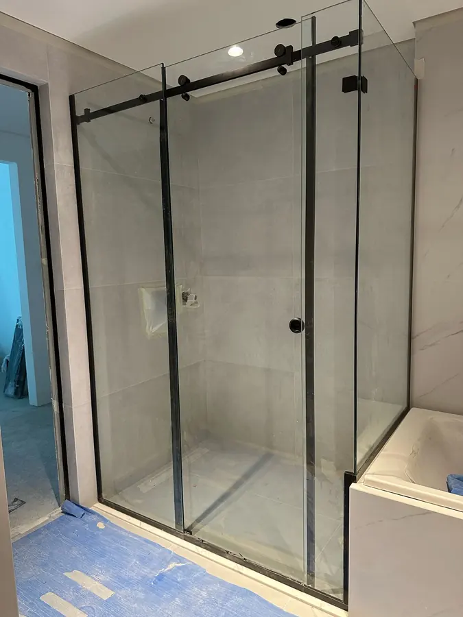 Black framed sliding shower glass enclosure in Dubai