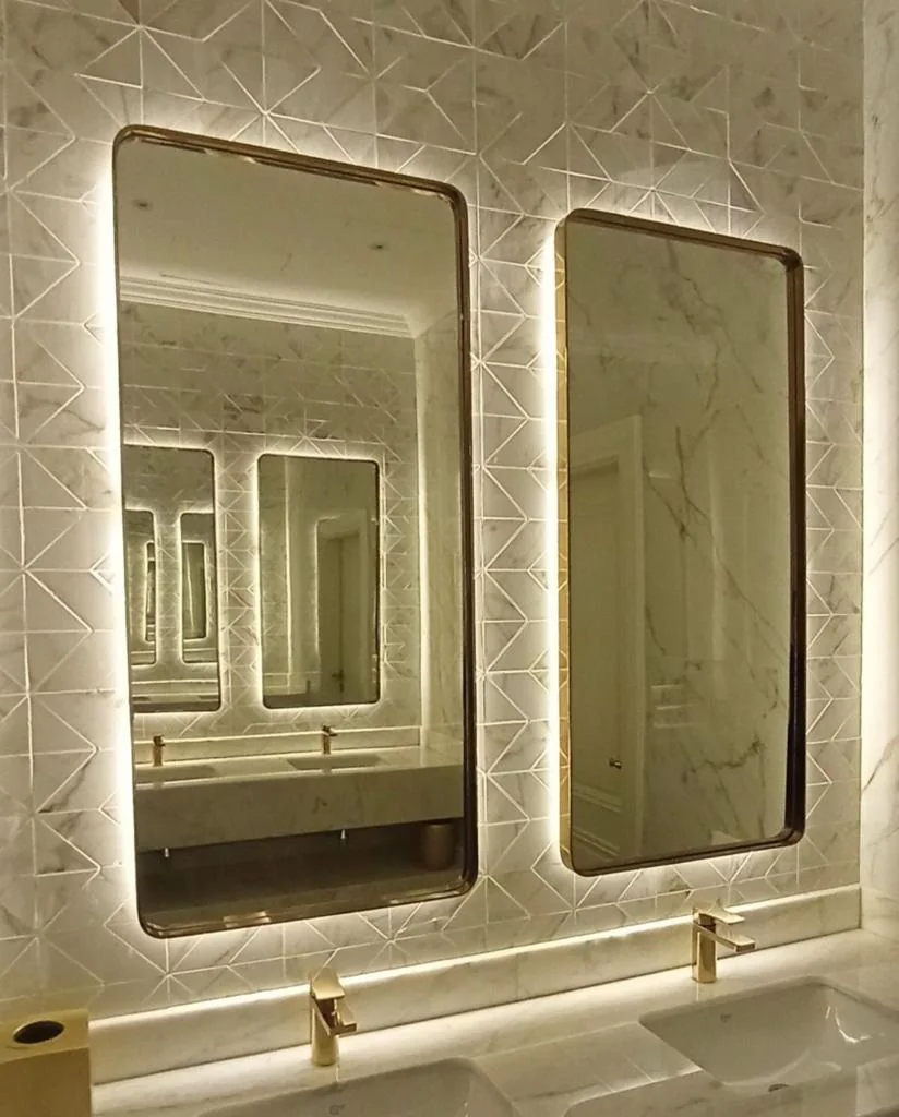 Pair of framed LED mirrors above a double vanity