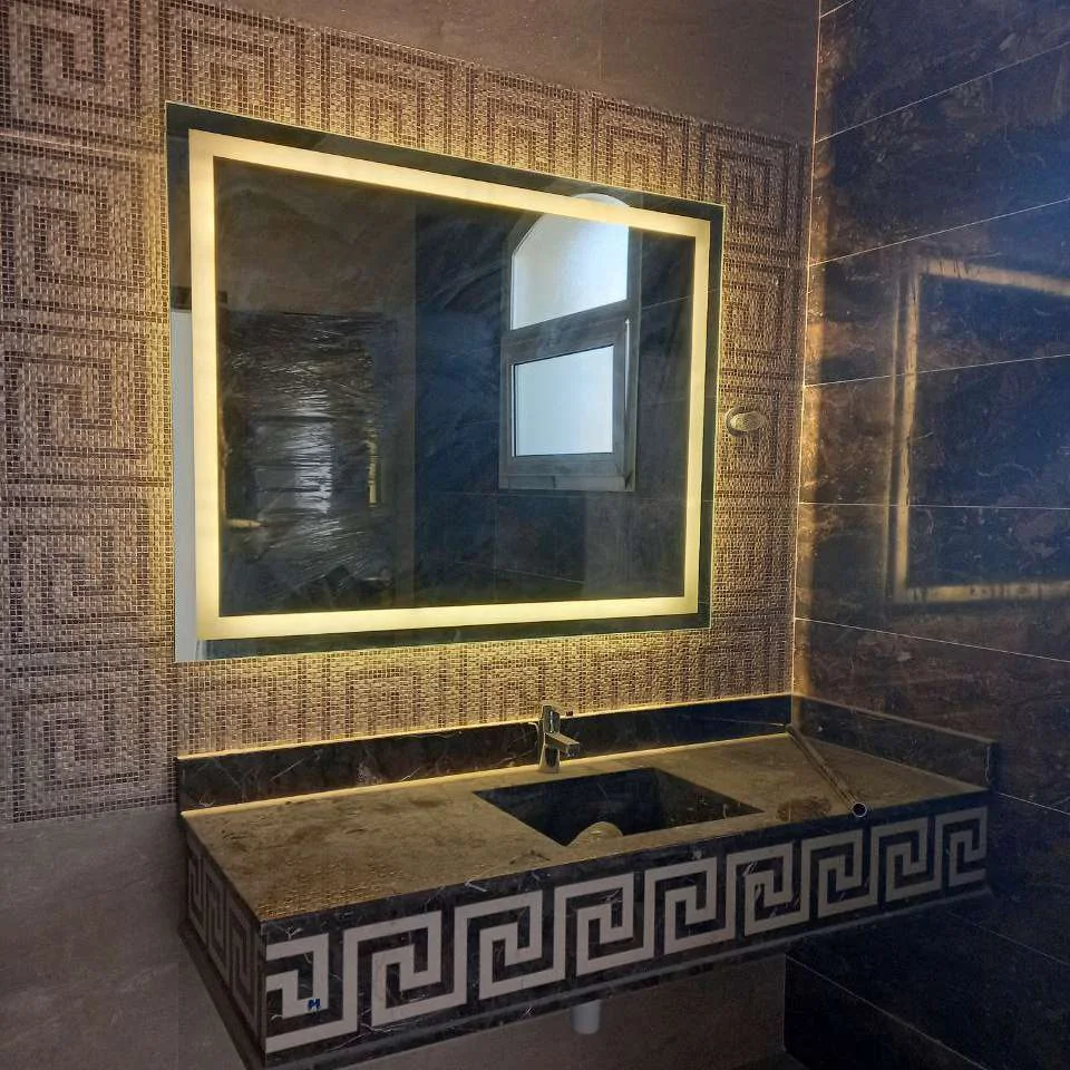 Square framed mirror with LED backlighting