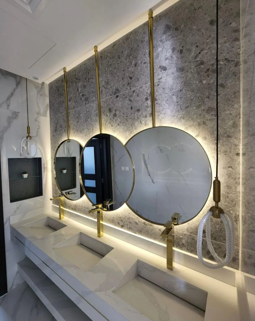 Three round framed mirrors with LED backlighting