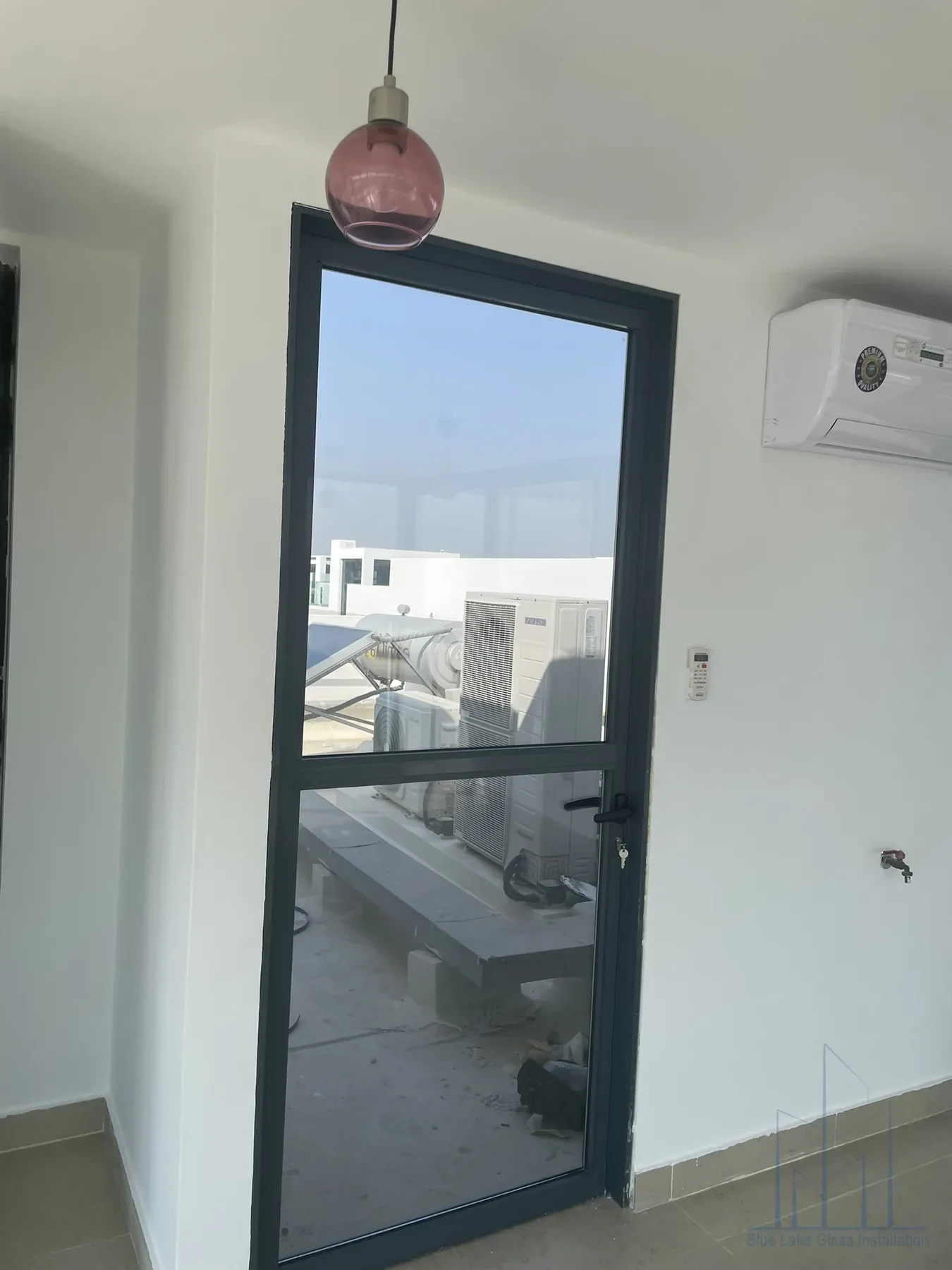 Custom hinged aluminum door for a residential entrance