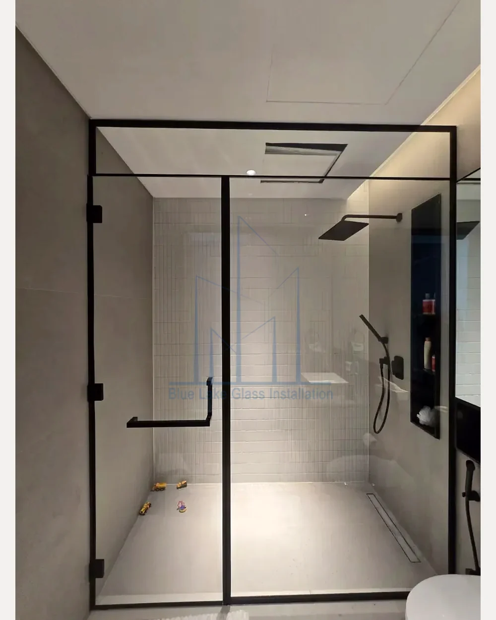 Black framed shower glass enclosure by Blue Lake Glass & Aluminum