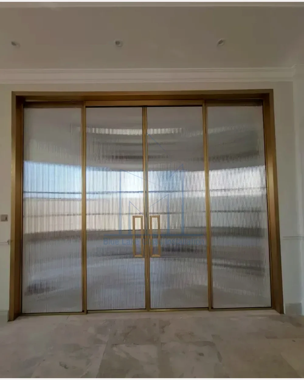 Fluted sliding shower glass door in bronze finish